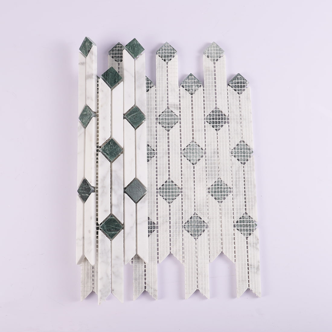 Back view of white and green marble linear mosaic tile with mesh backing