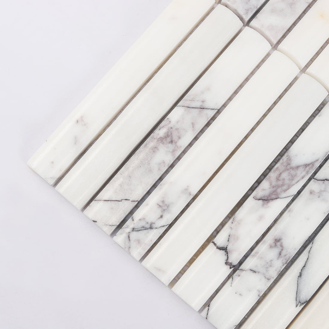 Corner detail of white and lilac marble finger mosaic tile