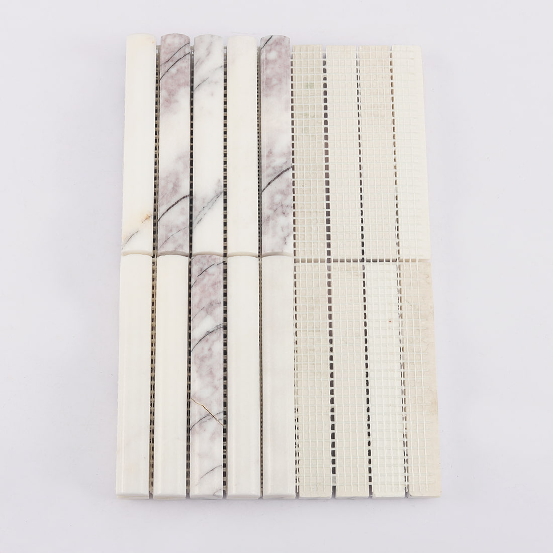 Back view of white and lilac marble finger mosaic tile with mesh backing