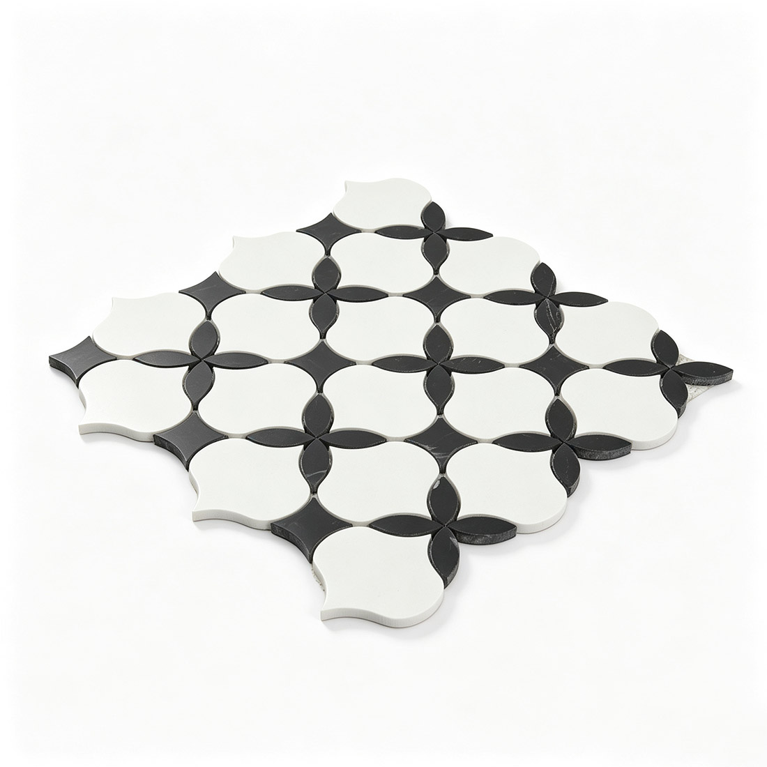 Angled view of white and black arabesque shape marble mosaic tile sheet