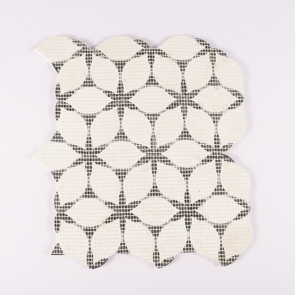 Back view of white and black petal marble mosaic tile on mesh backing