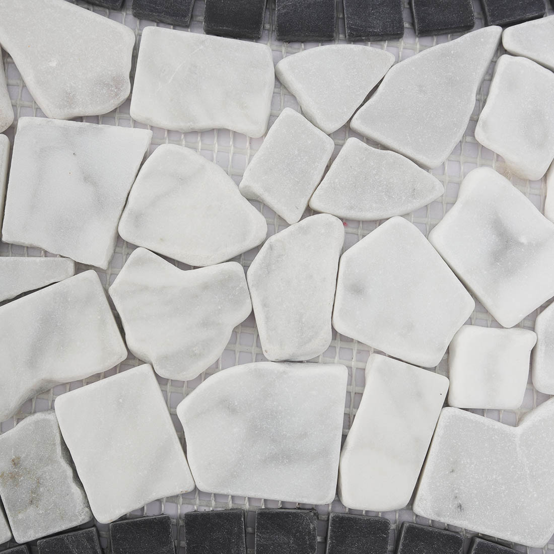 Textured white and black stone pebble mosaic surface