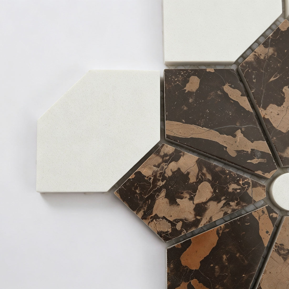 Close-up of white octagon and brown floral pieces in marble mosaic tile