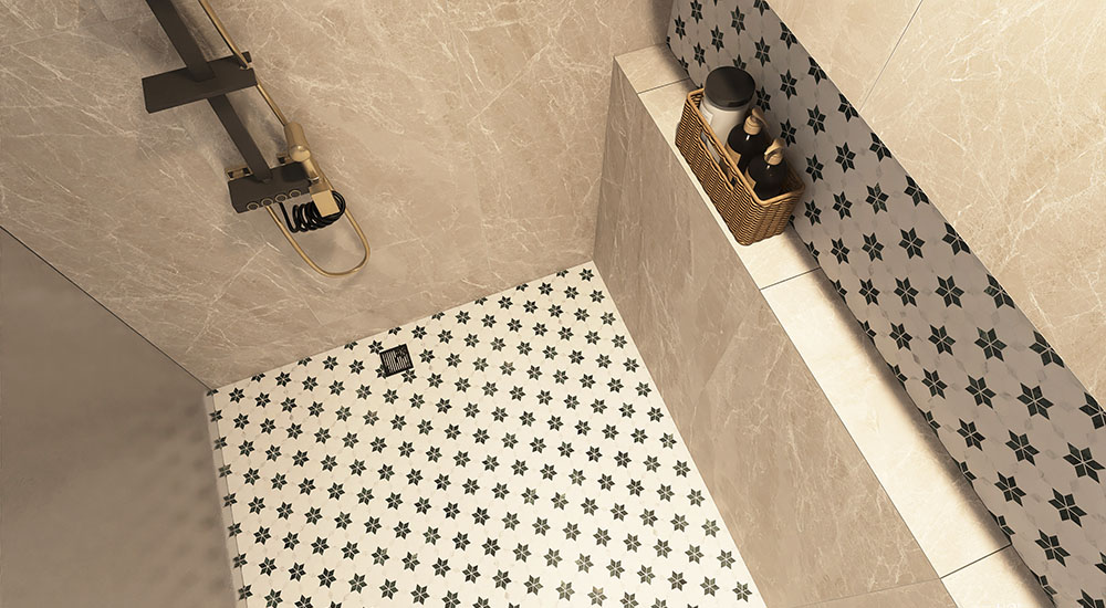Top view of a white floral mosaic shower floor with beige marble-look wall tiles