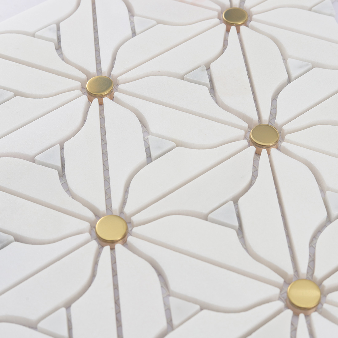 Side angle showing thickness and gold dot placement on white flower marble mosaic