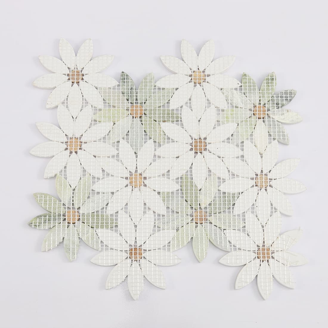 Back view of white and green flower marble mosaic tile with mesh backing