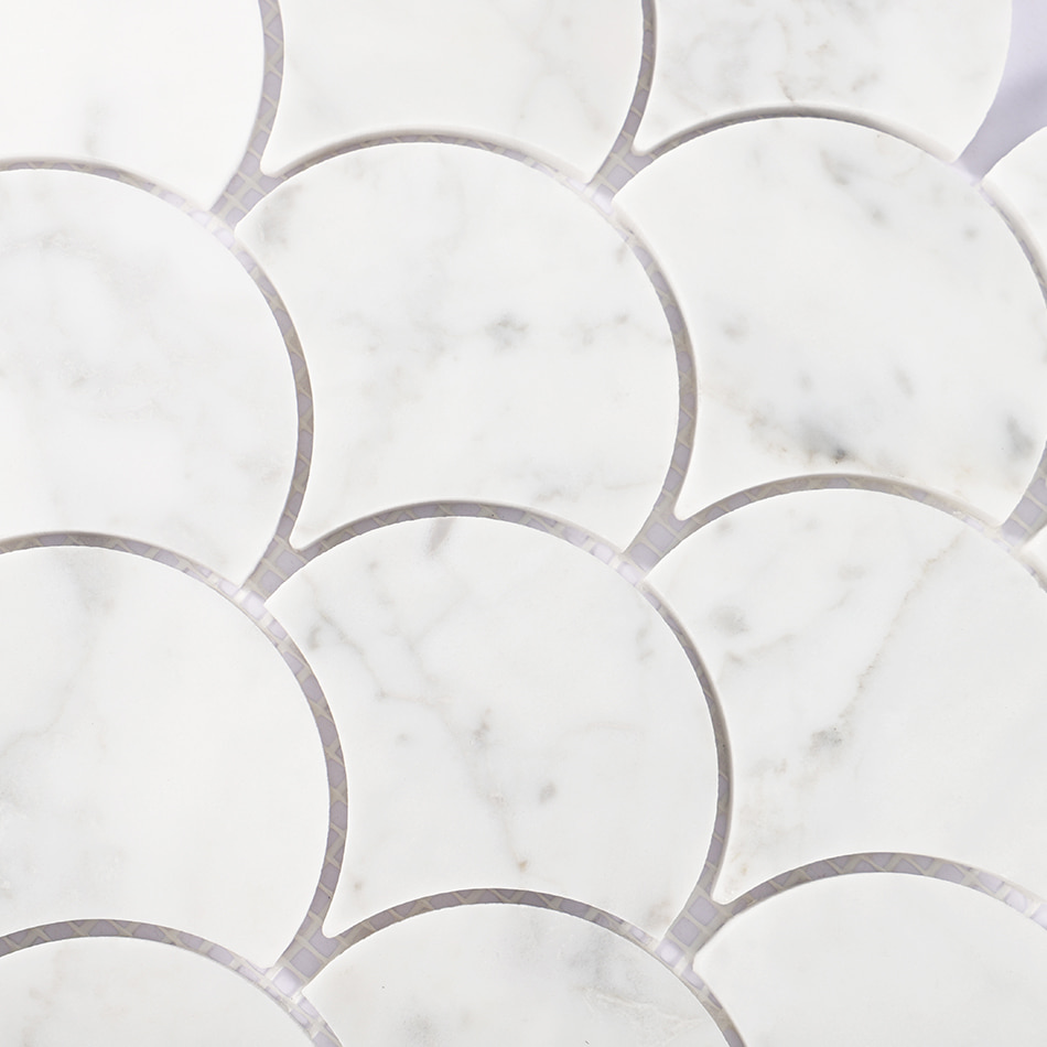 Surface detail of white marble fan mosaic tile pattern