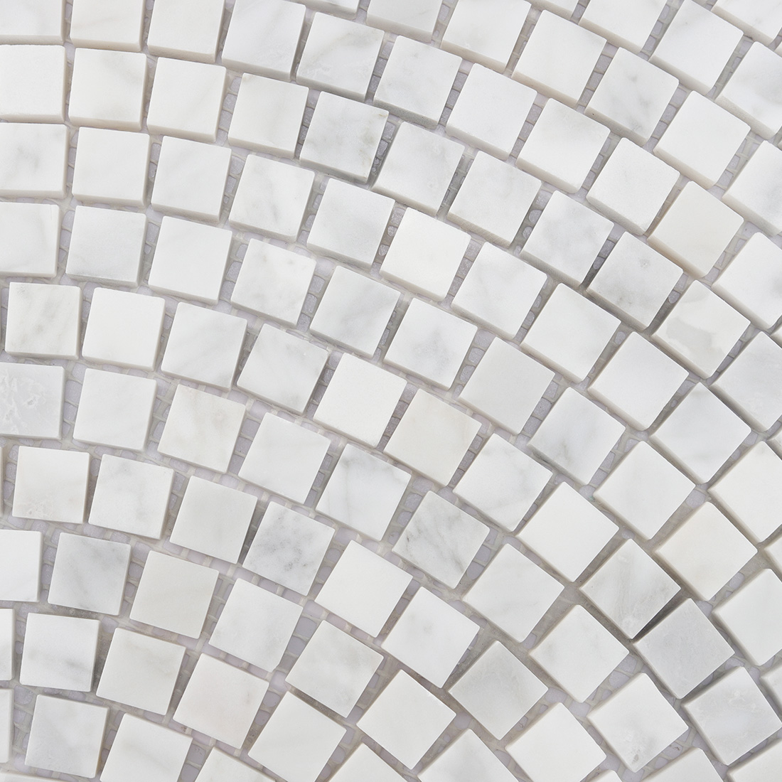 Close-up of white marble fan-shaped mosaic with square marble chips