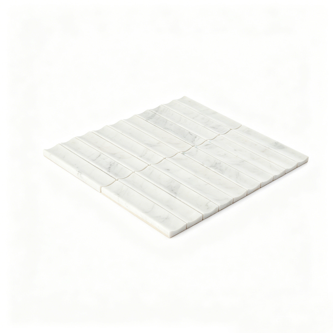 Angled view of white marble fluted linear mosaic.