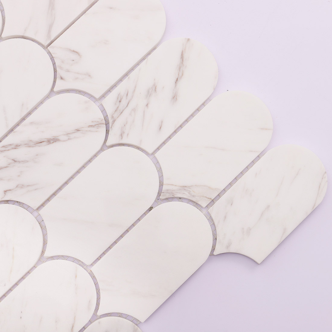 Close up texture detail of polished white marble mosaic tiles