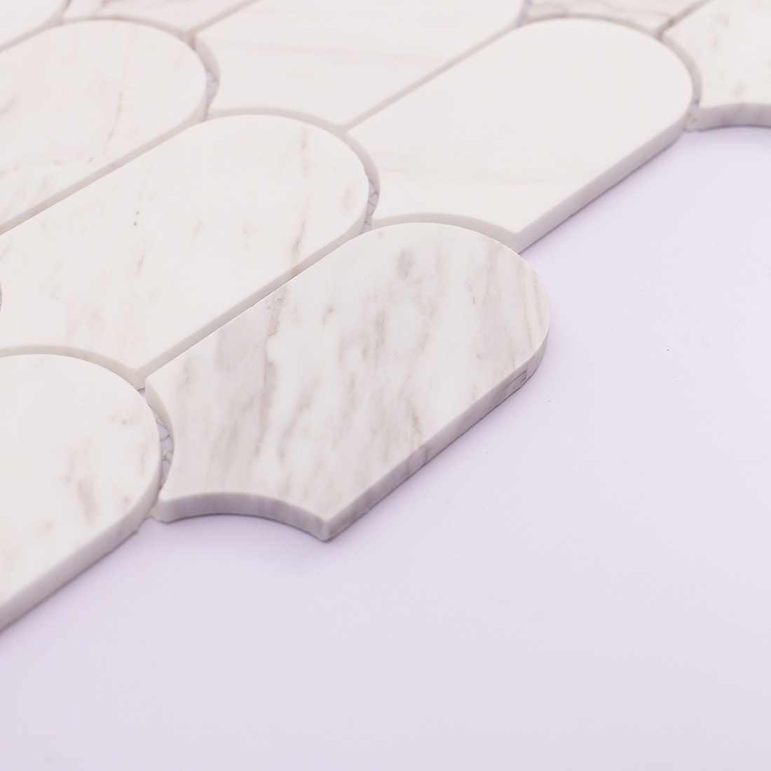Side view showing the edge and thickness of white marble tile