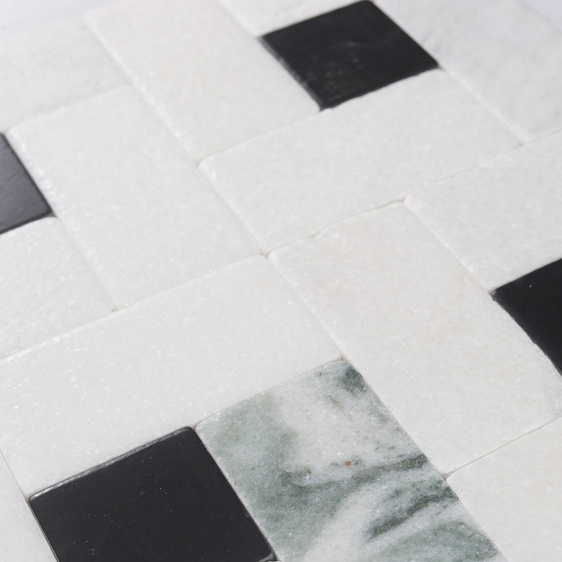 High angle view of white and black marble pinwheel mosaic texture