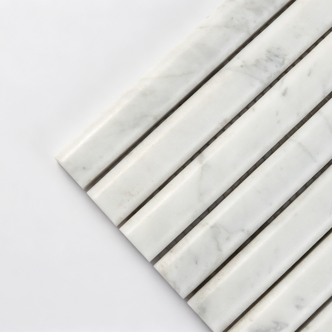 Close-up corner detail showing the texture of white marble rod tile.