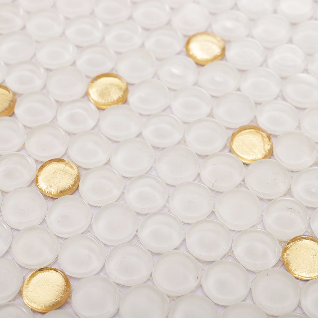 Surface texture of white penny round glass mosaic tile with metallic gold accents