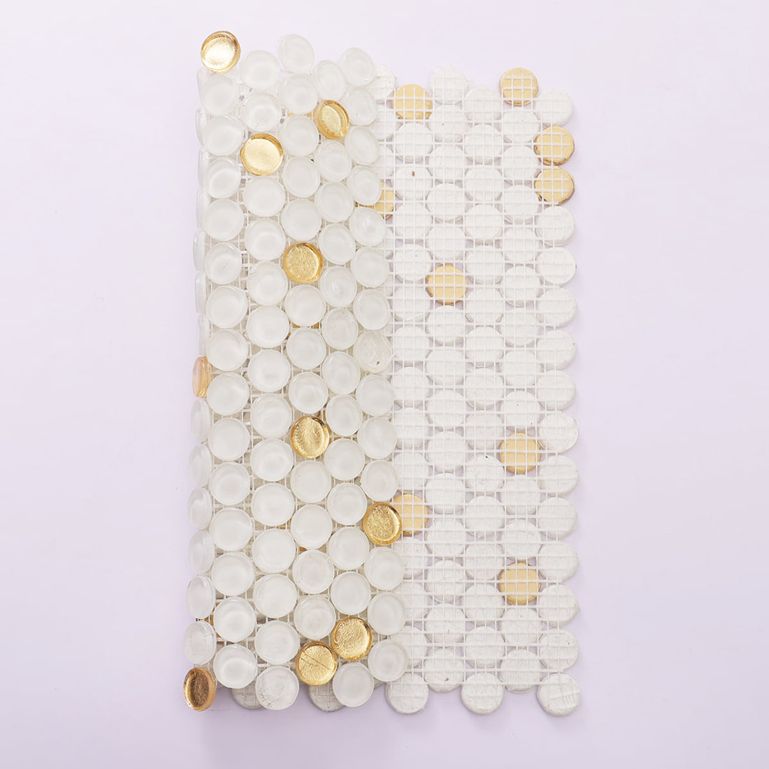 Back view of white penny round glass mosaic tile showing fiberglass mesh backing