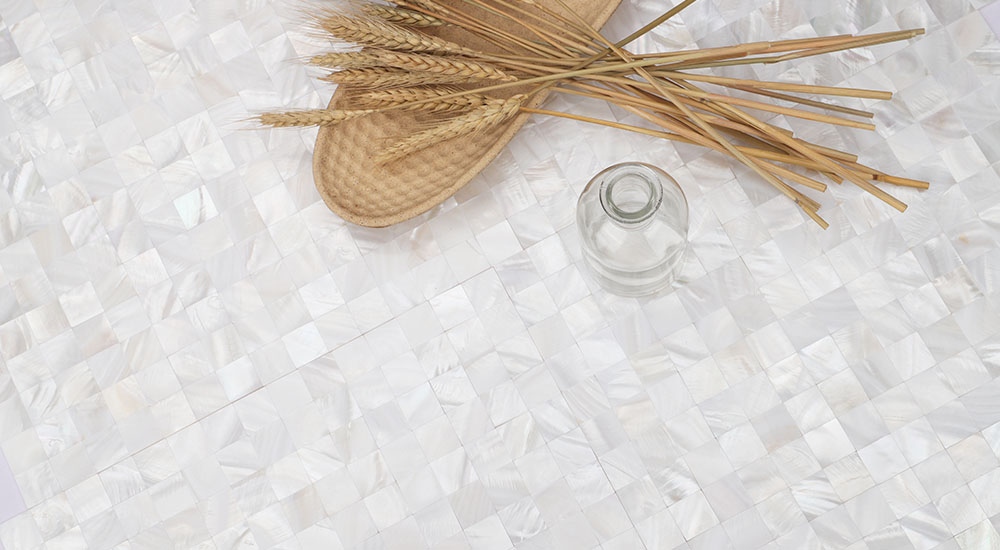 {"default":"White iridescent shell square wall tiles in a clean, modern mosaic pattern."}
