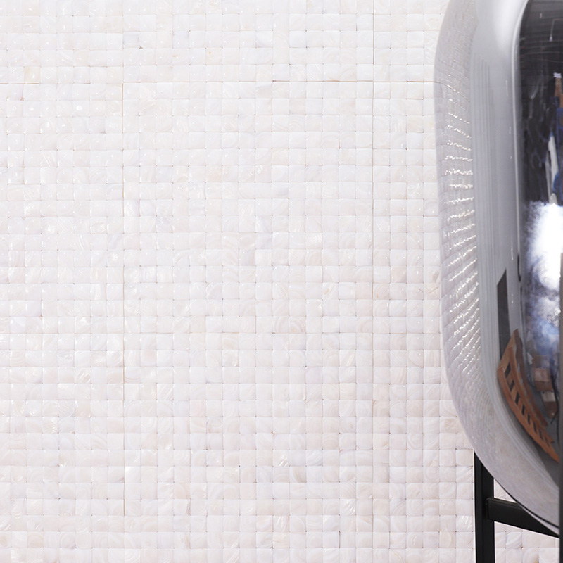 White shell mosaic wall tiles with a pearlescent finish in a modern setting.