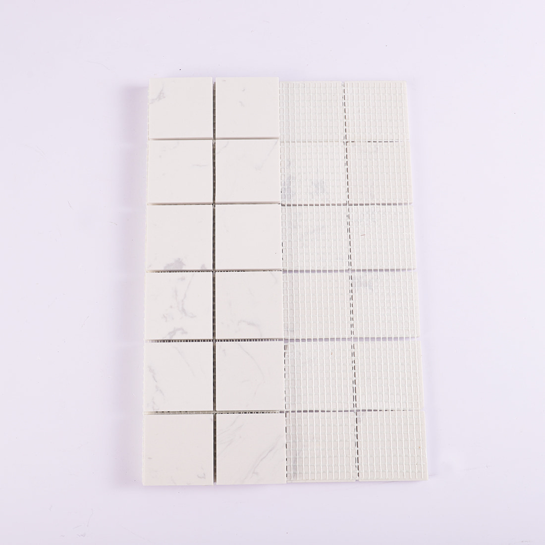 Back view of white square marble mosaic tile with mesh backing