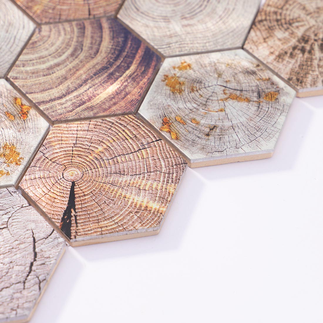 Angle shot of wood grain hexagon aluminum tile edge with gold accents