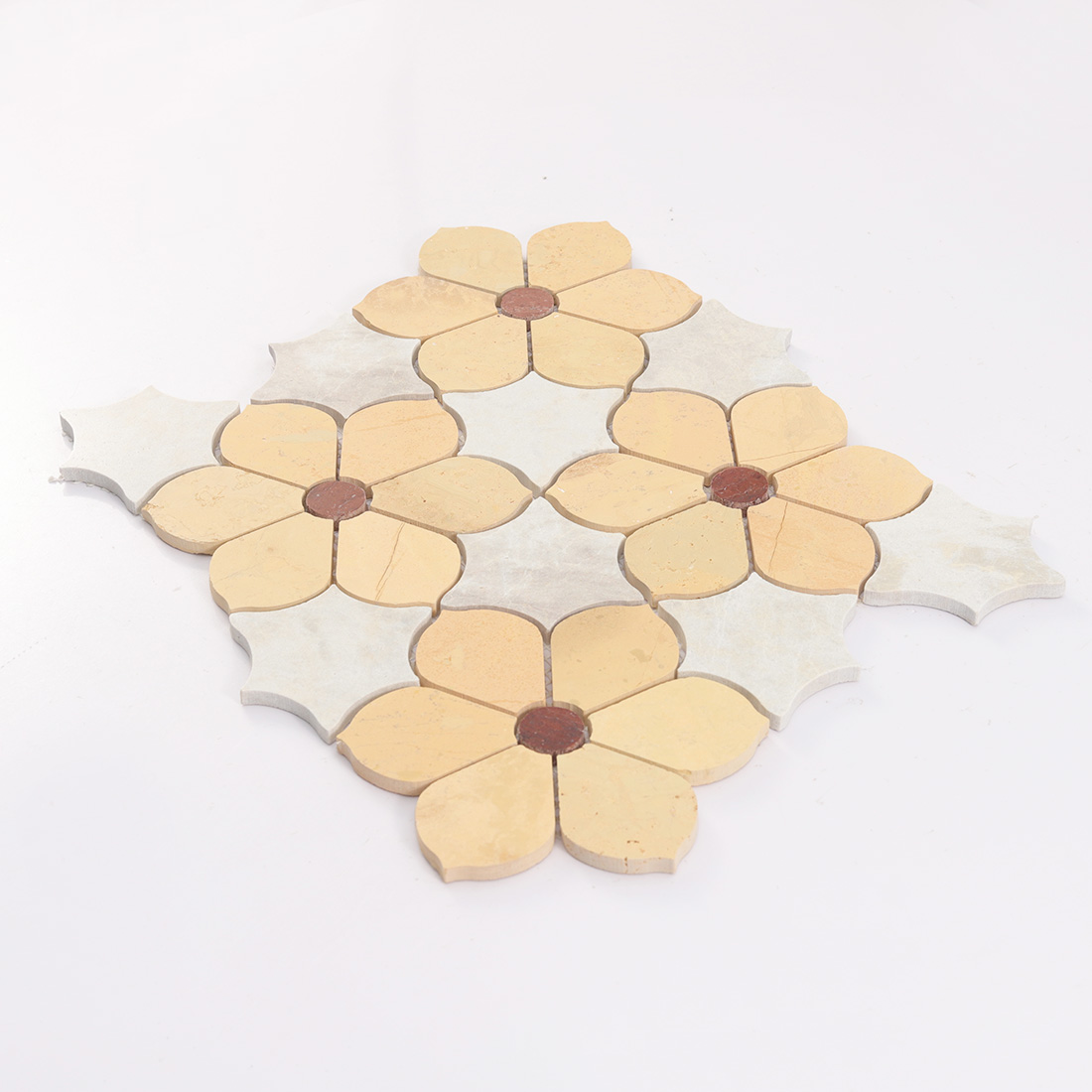 Low angle view of yellow floral stone mosaic tile with red round centers