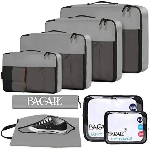 8 packing cubes set with clear bags and shoe bag for efficient travel organization in grey. Ideal luggage accessory.