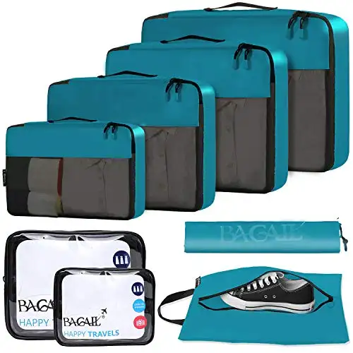 8 set packing cubes in teal with clear bags and shoe bag for efficient luggage organization and travel accessories.