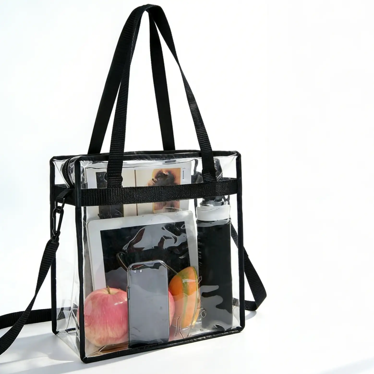 Clear stadium-approved tote bag, crossbody messenger style with adjustable strap and zipper closure for convenience.