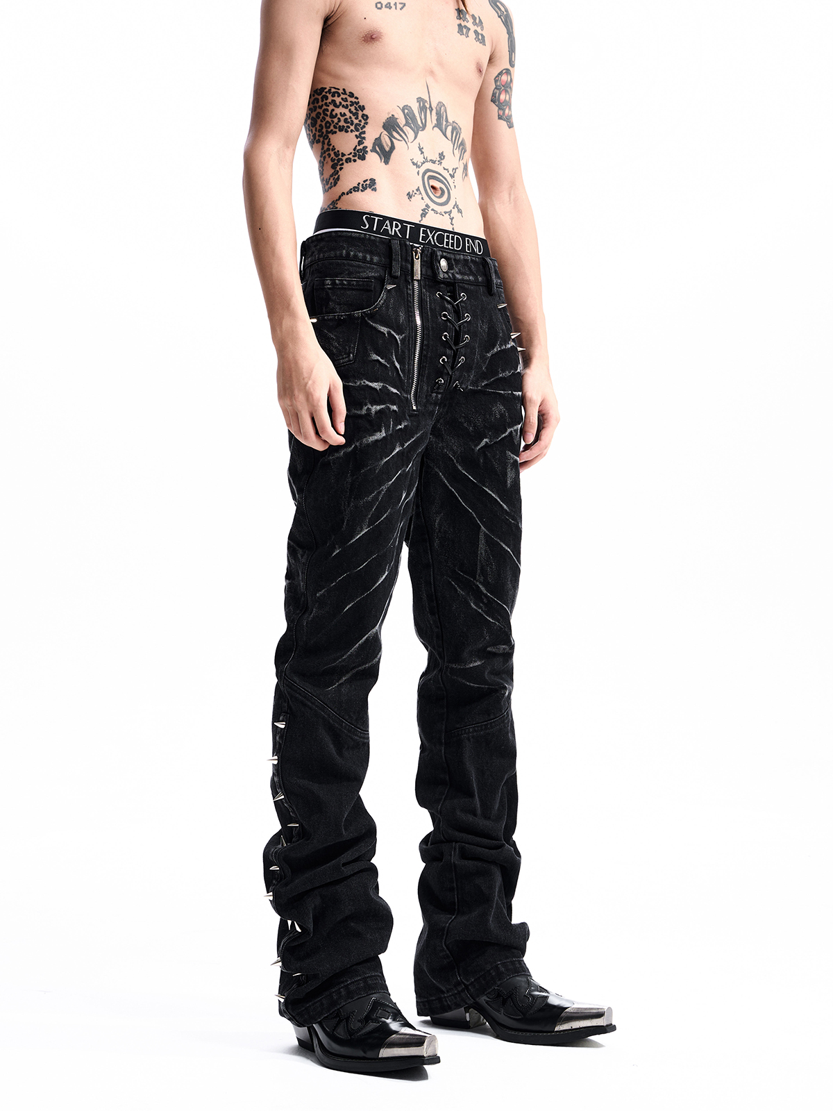 STUDDED ASYMMETRIC FLY JEANS
