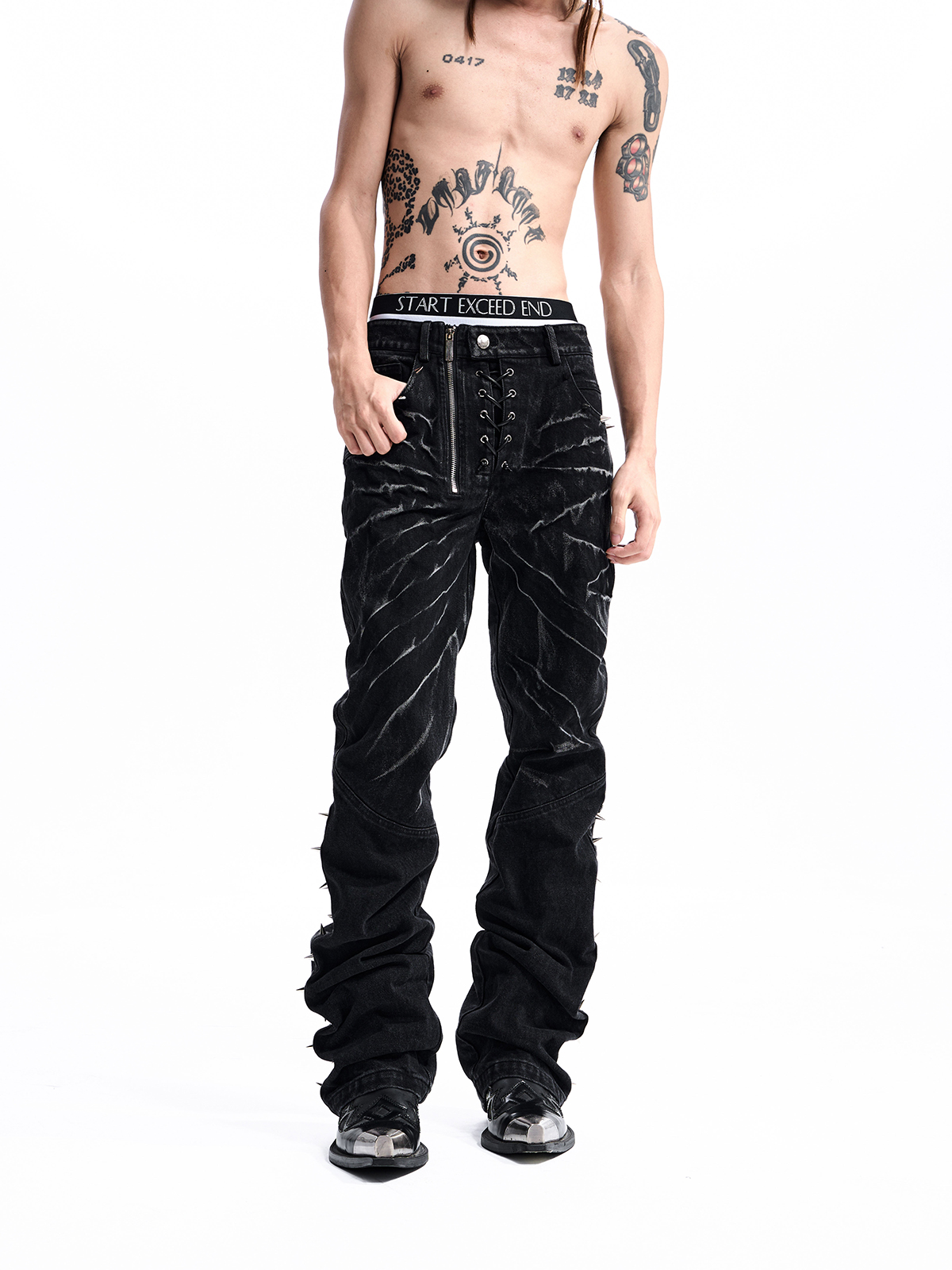 STUDDED ASYMMETRIC FLY JEANS
