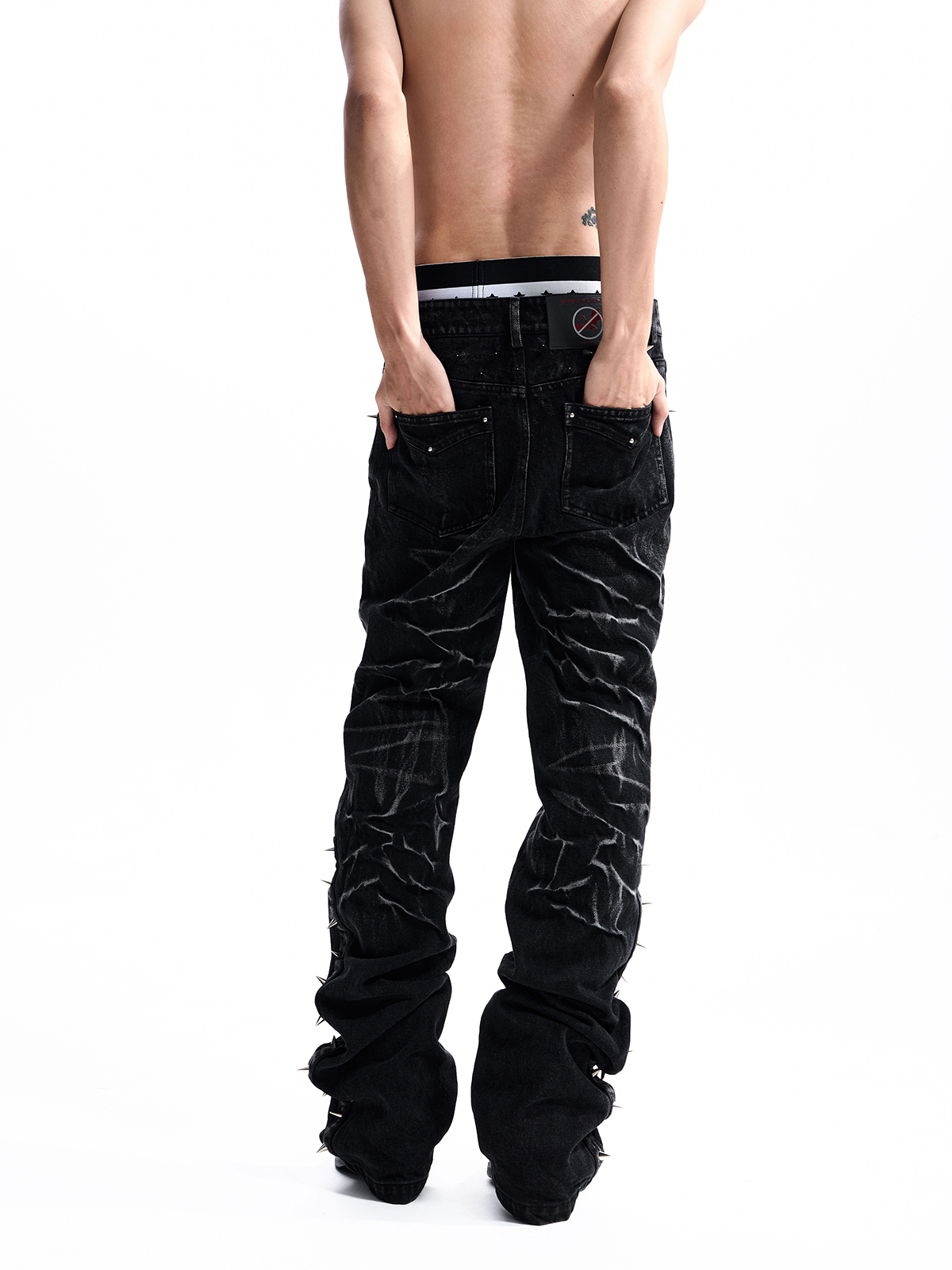 STUDDED ASYMMETRIC FLY JEANS
