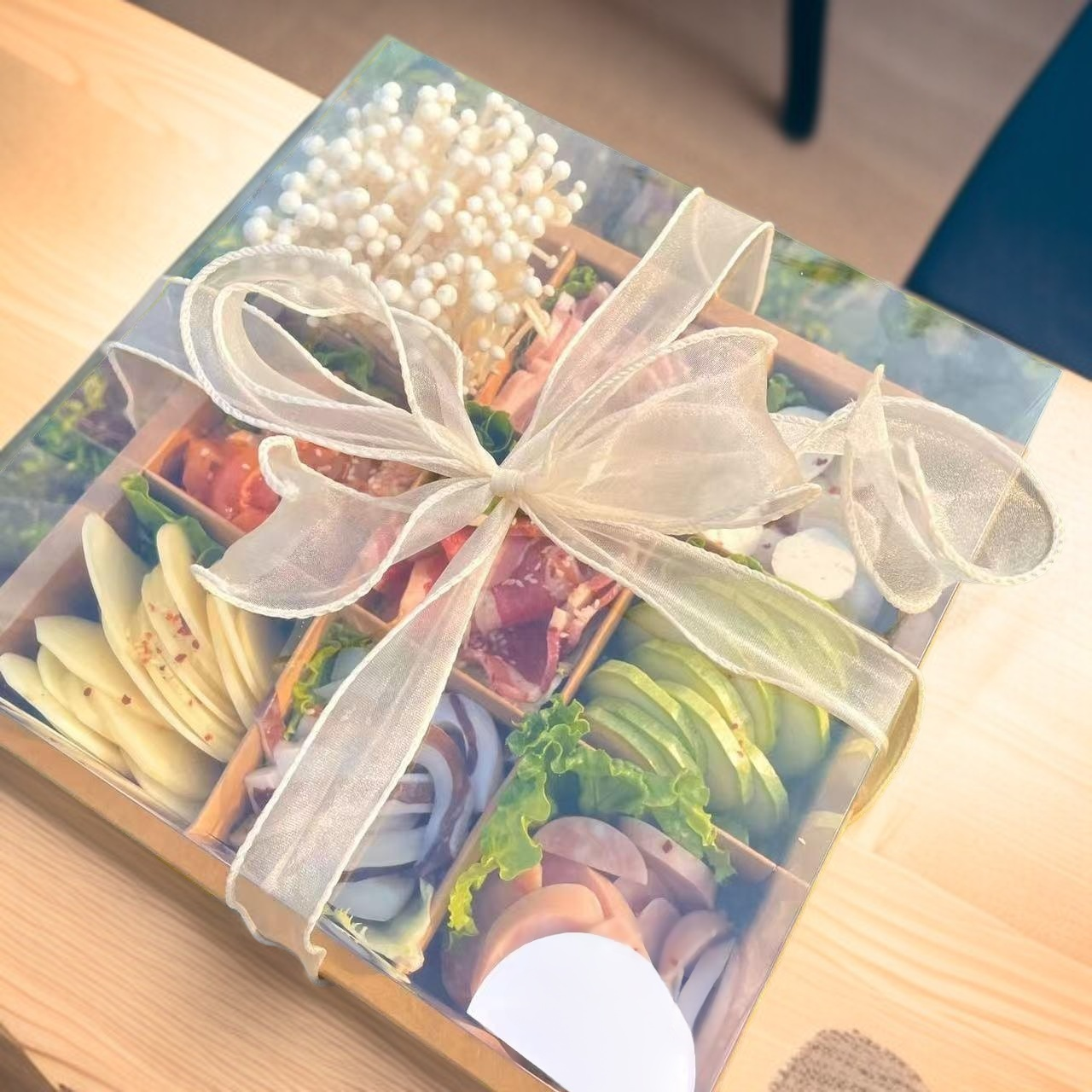 Reusable meal box featuring nine separate sections