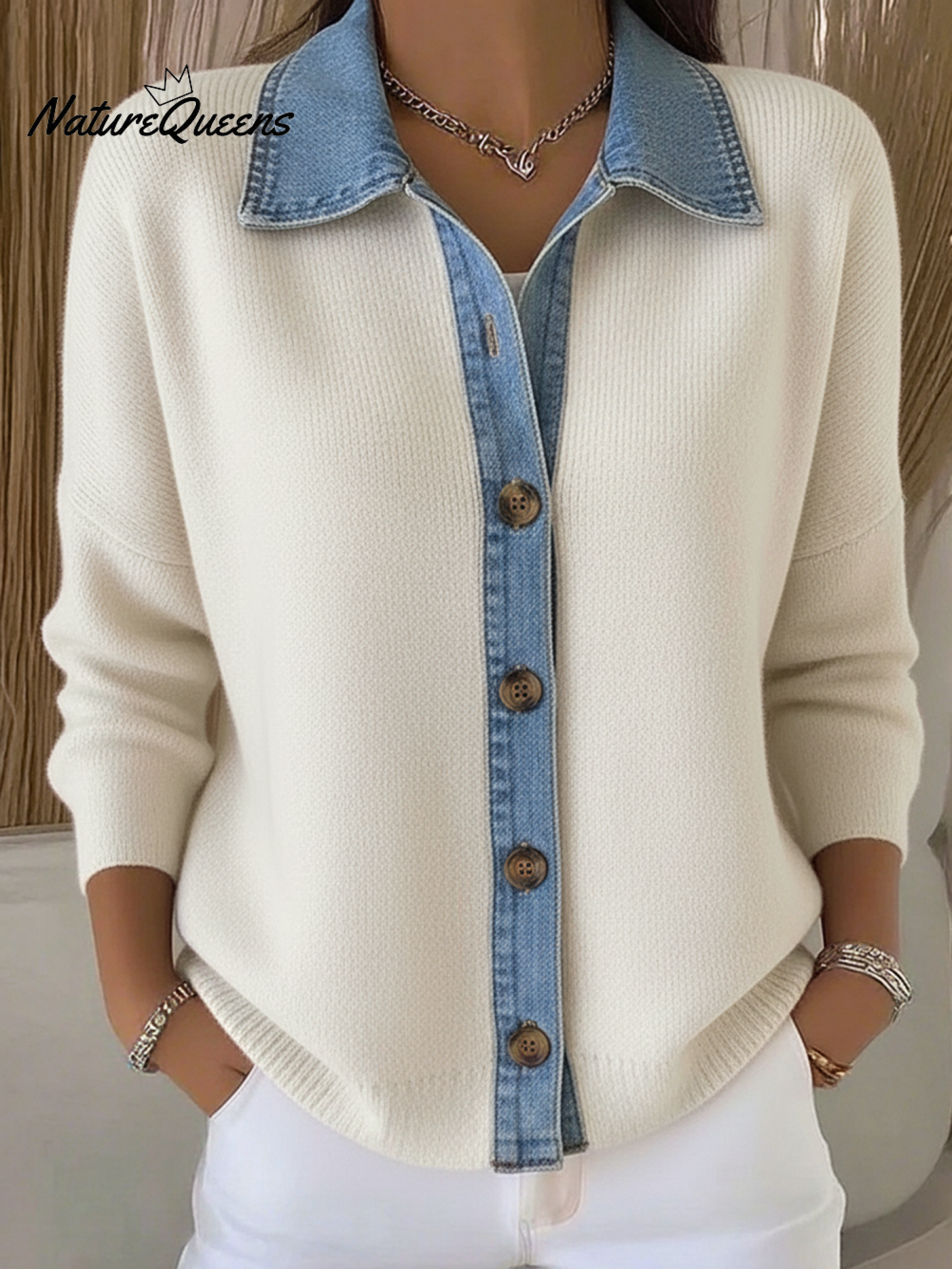 Knitted cardigan sweater in a denim style with a polo collar and buttons.