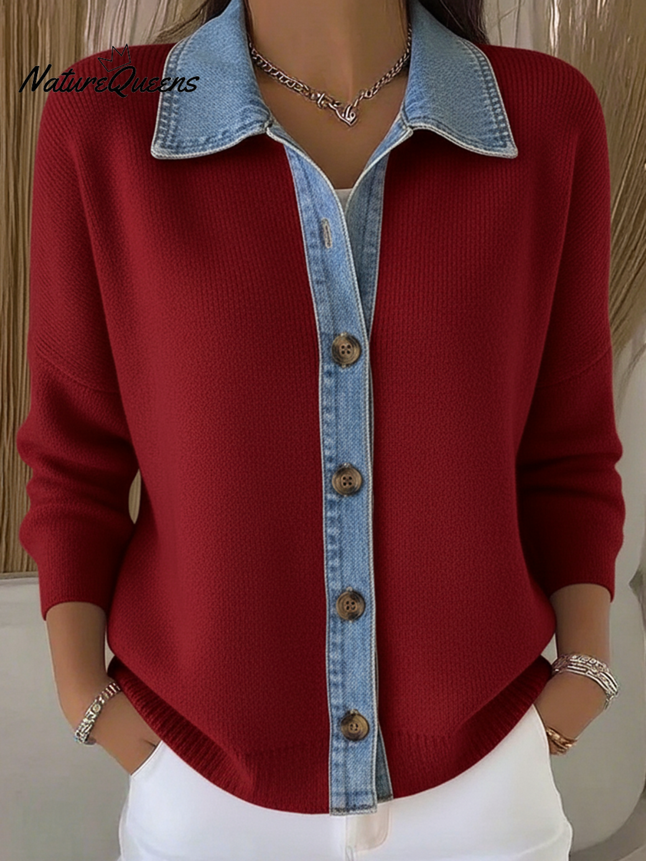 Knitted cardigan sweater in a denim style with a polo collar and buttons.