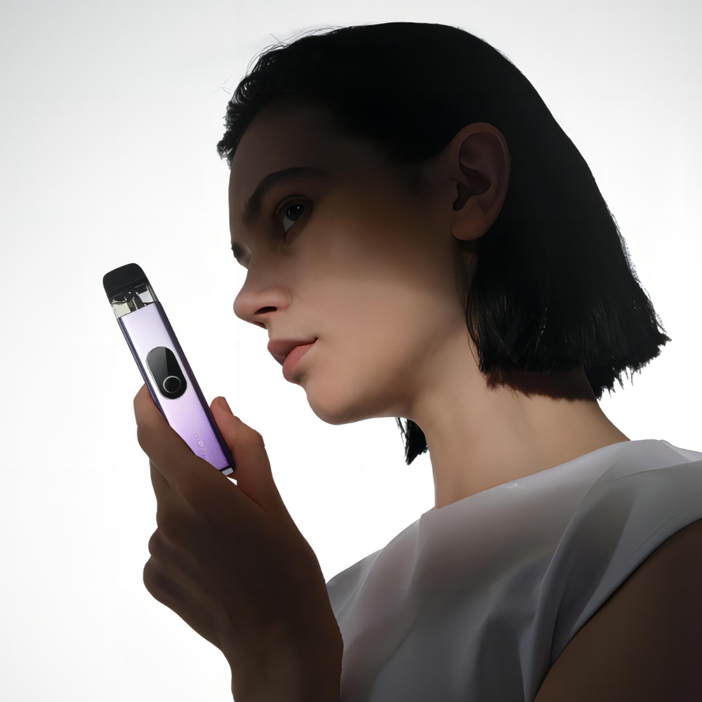 Vaporesso XROS 4 vape in purple held by woman, showcasing sleek design and user-friendly interface