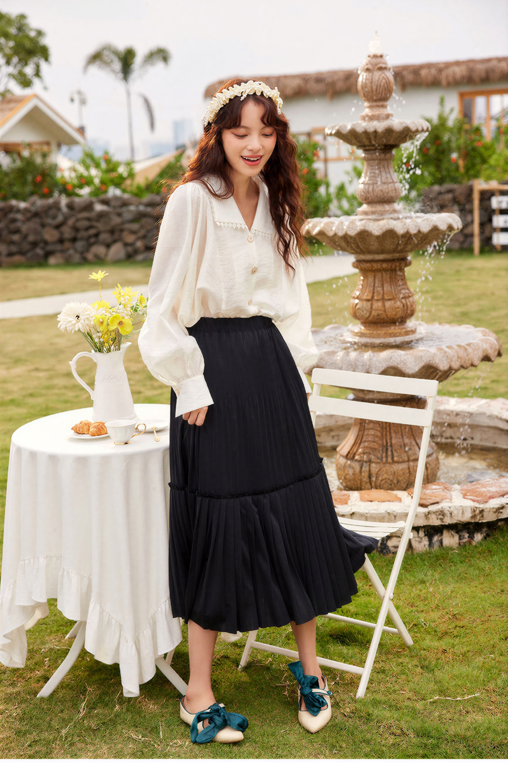 Black pleated midi skirt