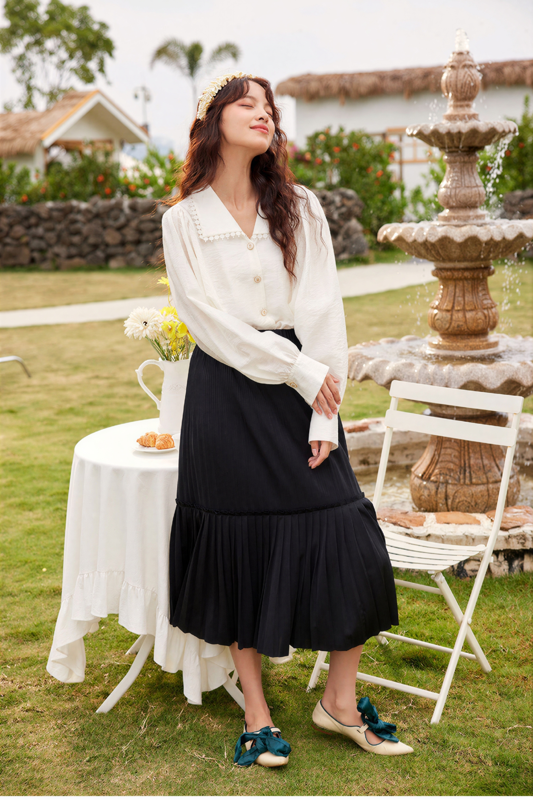 Black pleated midi skirt