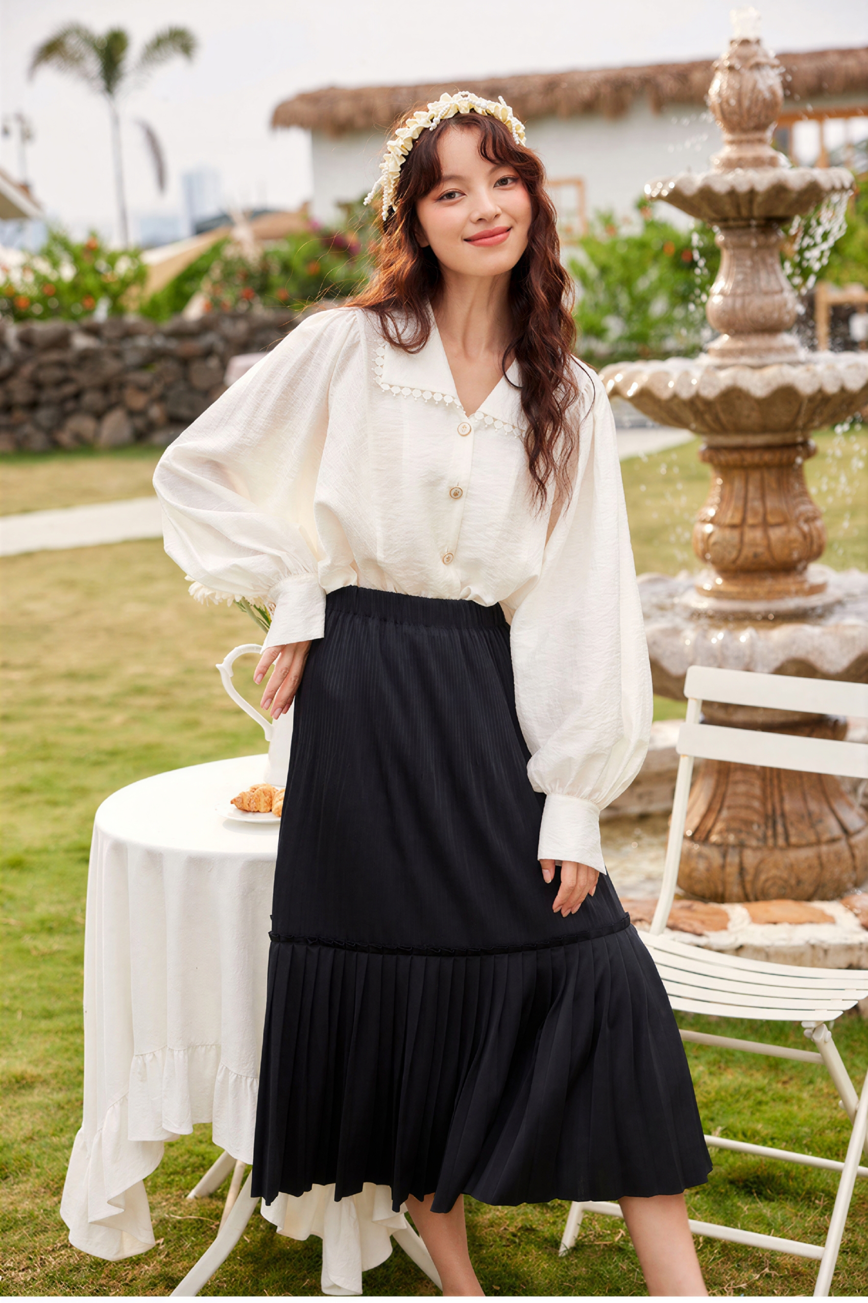 Black pleated midi skirt