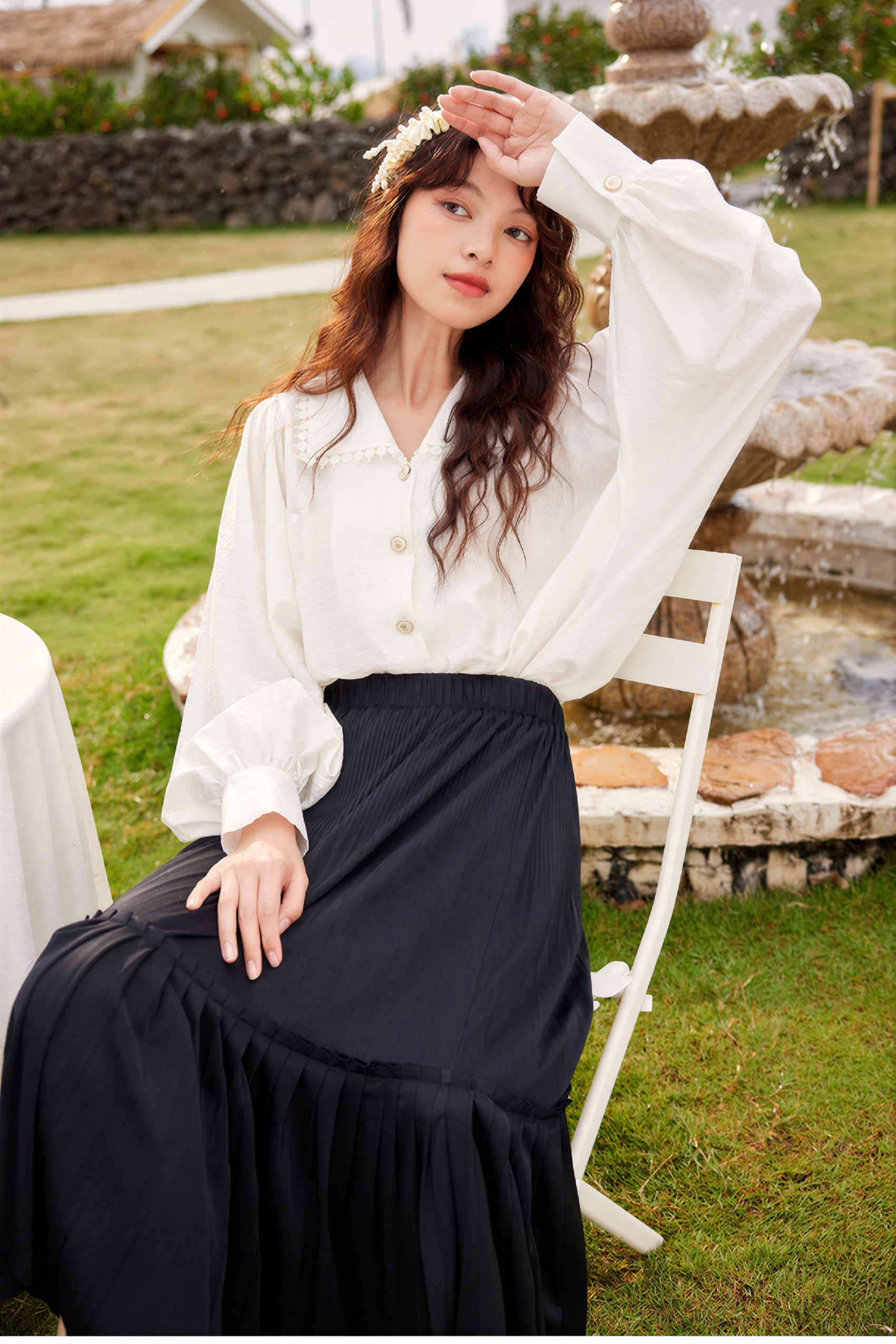 Black pleated midi skirt