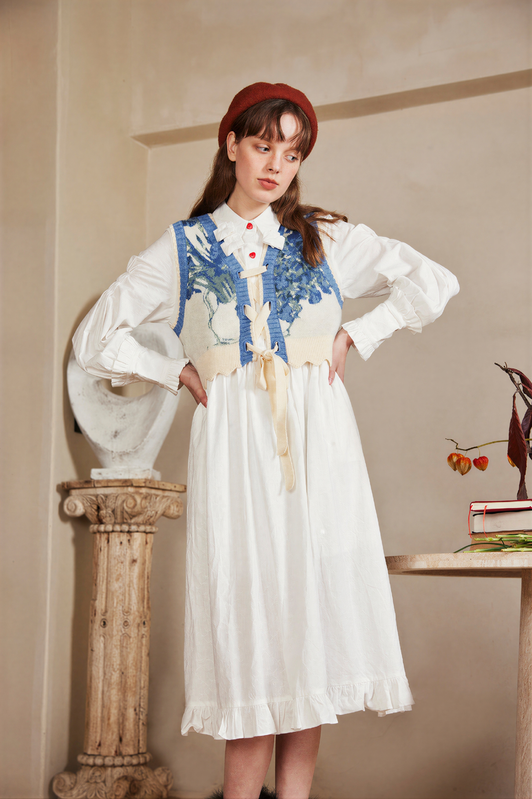 Vintage-style outer layer paired with a knitted sweater