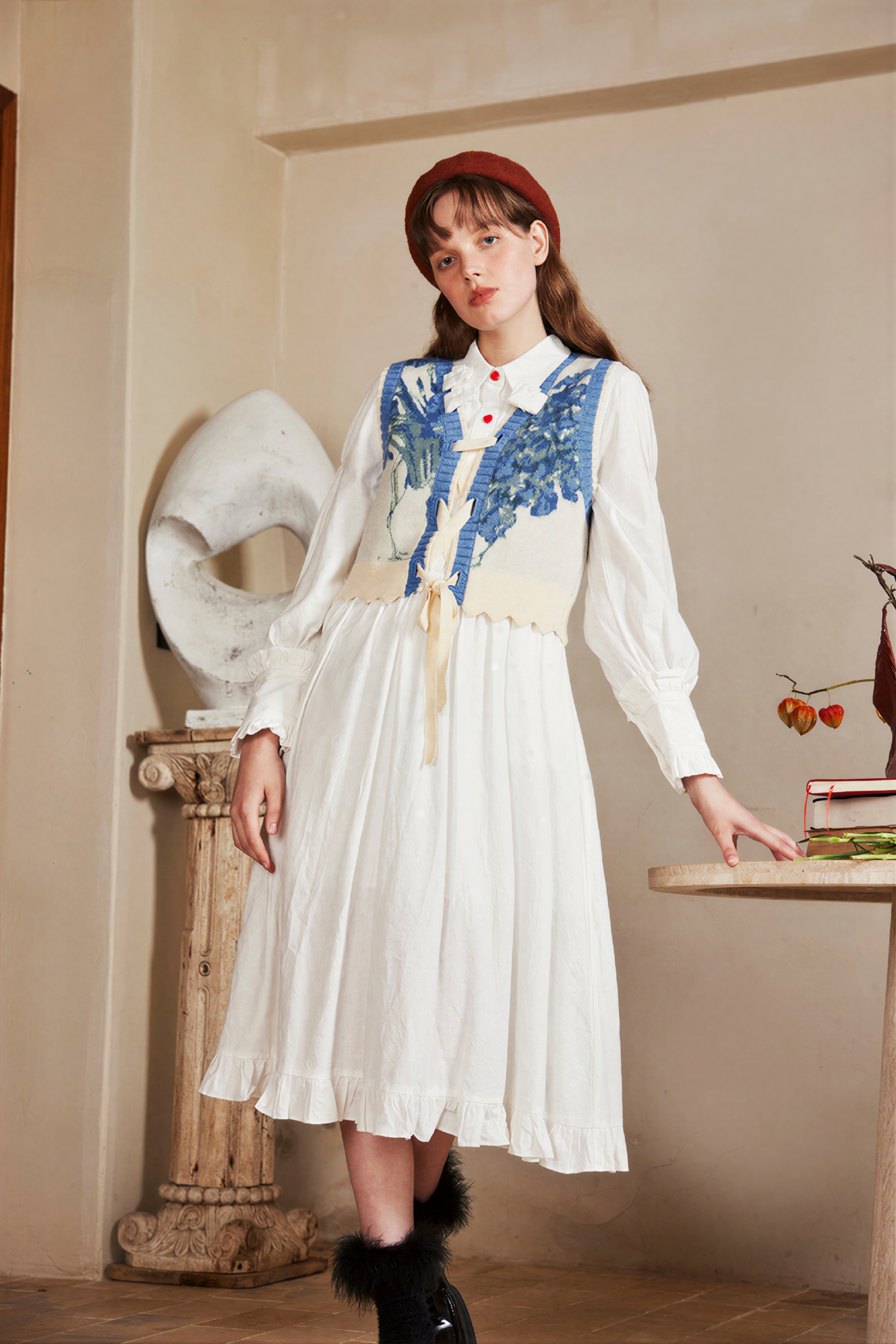 Vintage-style outer layer paired with a knitted sweater