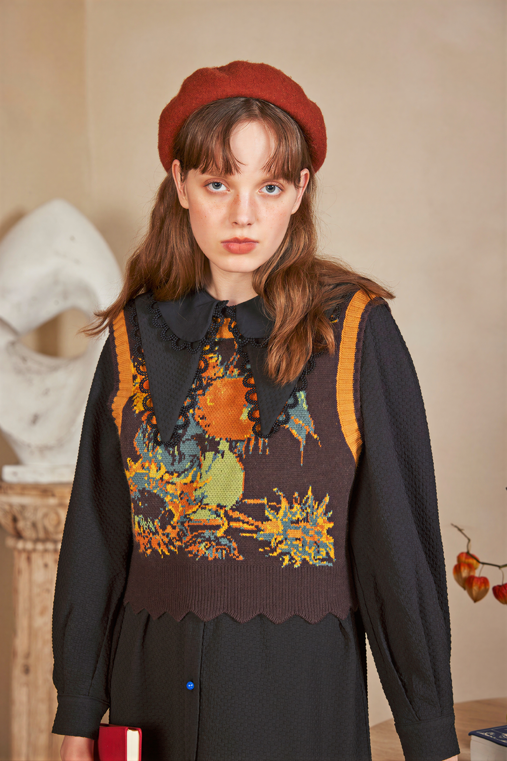 Vintage-style outer layer paired with a knitted sweater