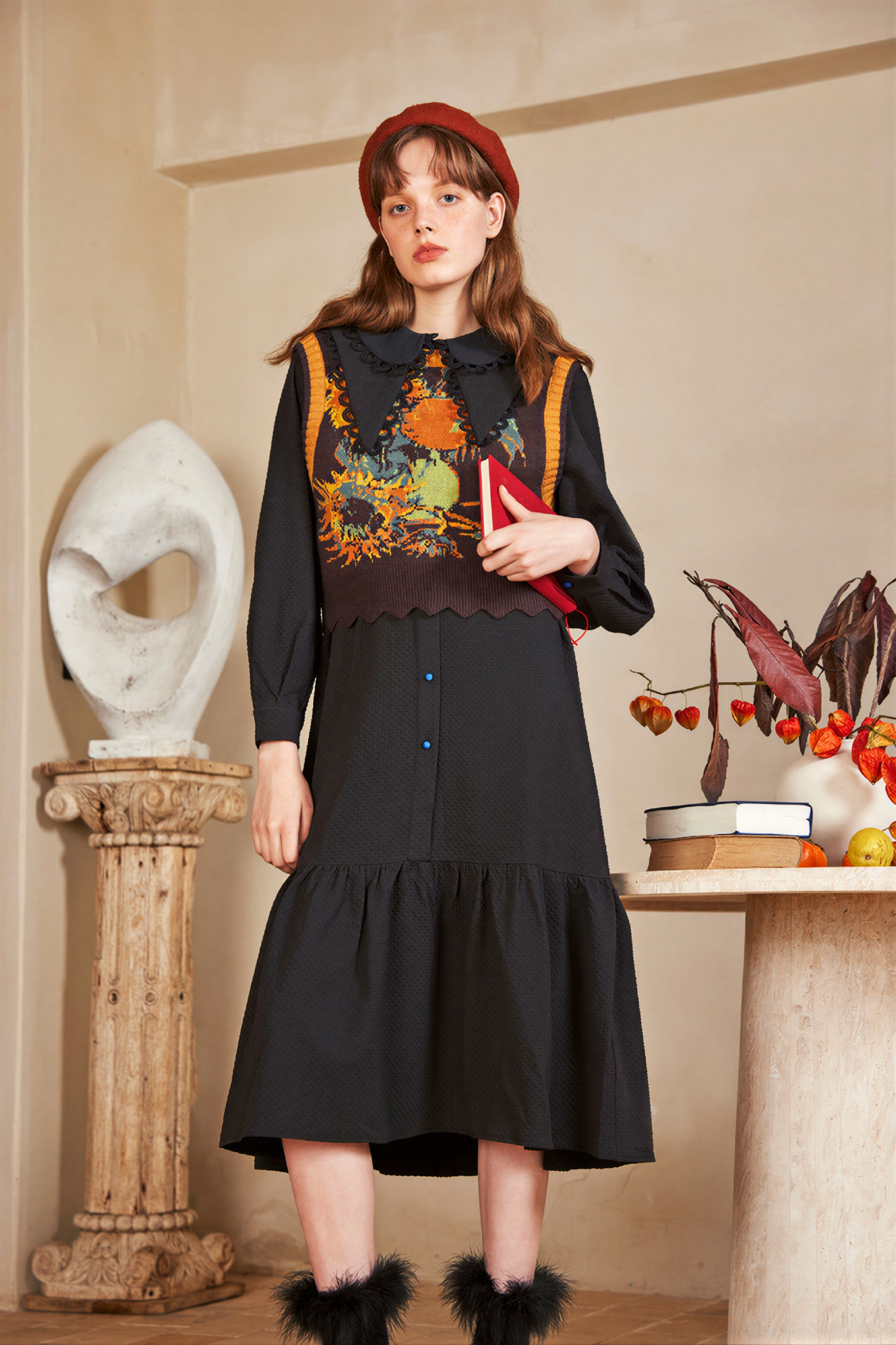 Vintage-style outer layer paired with a knitted sweater