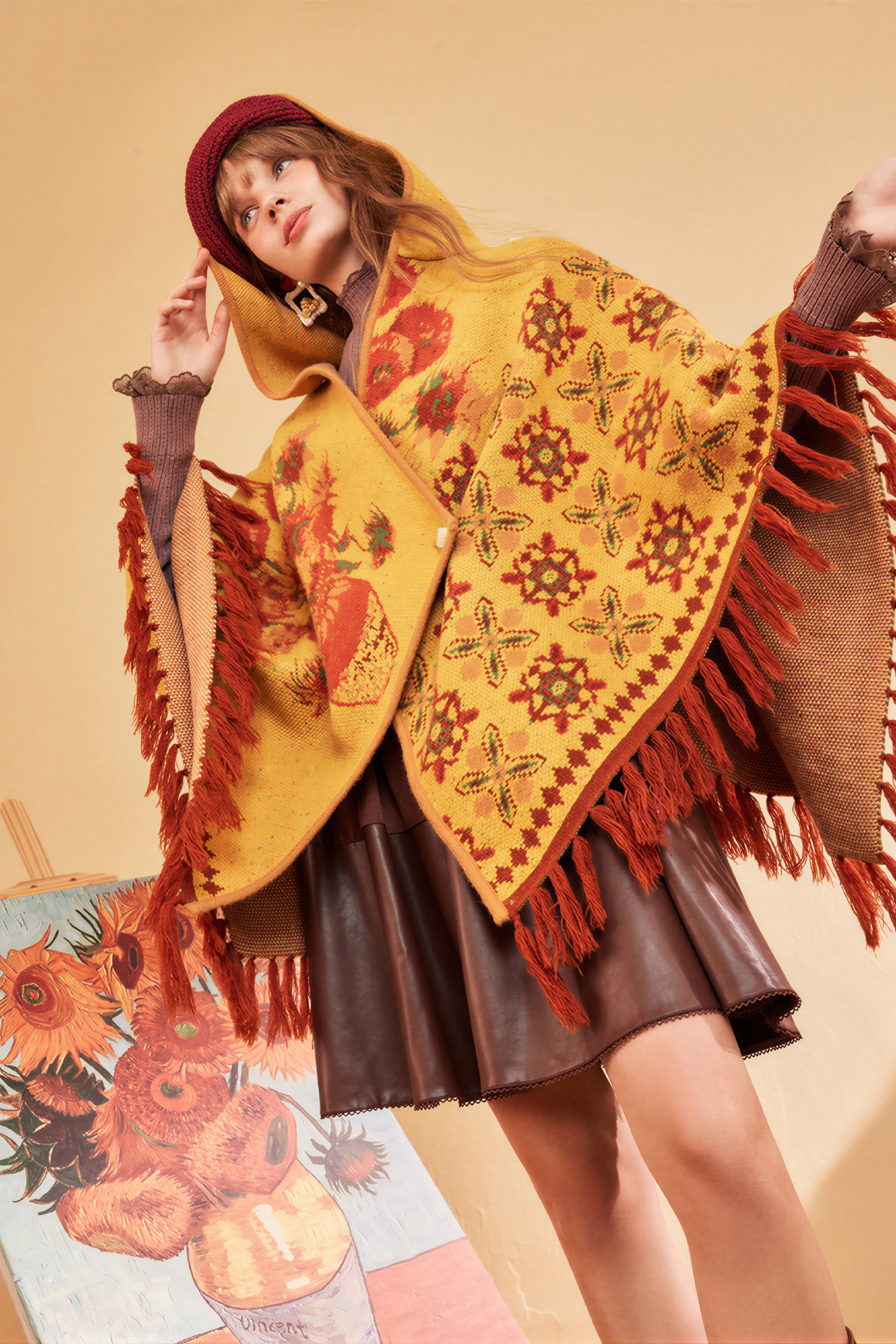 Hooded blue knitted cape