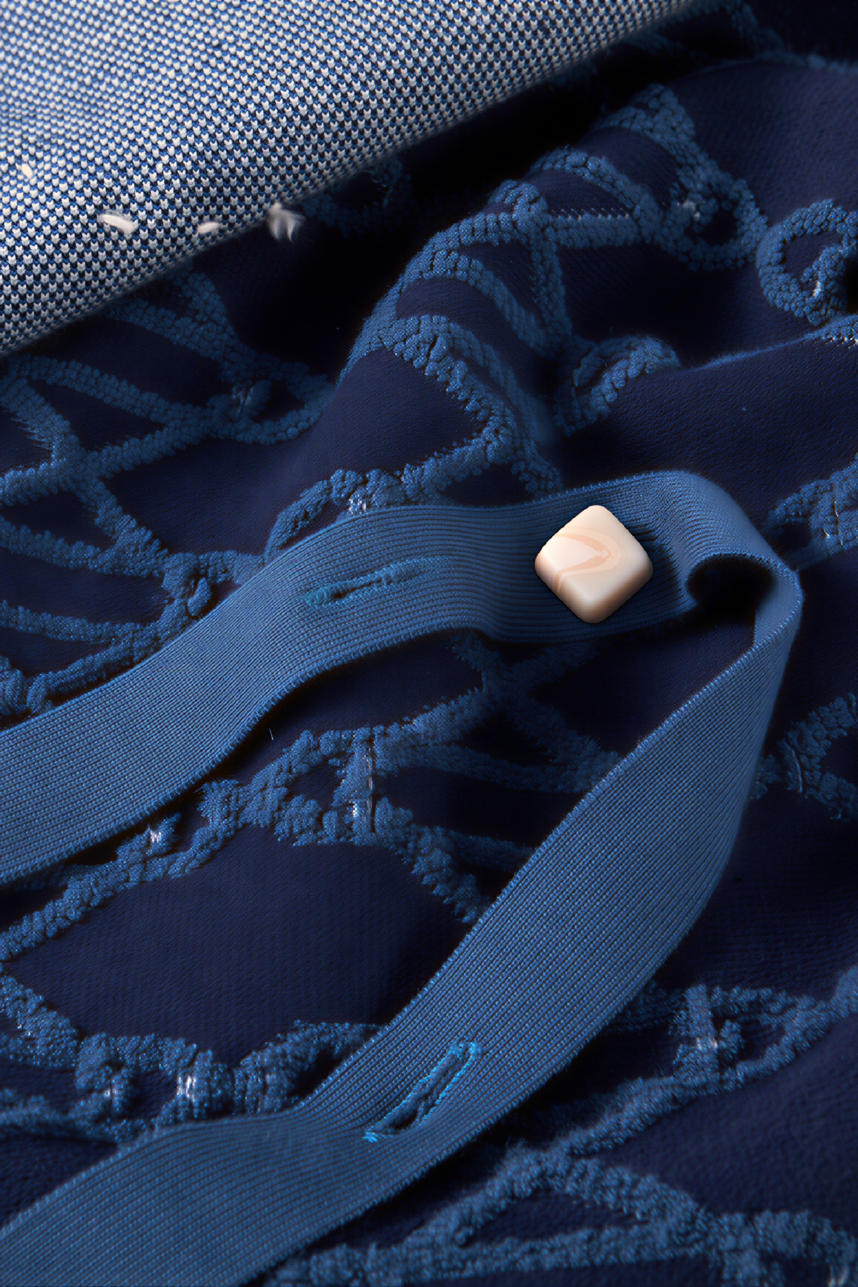 Hooded blue knitted cape