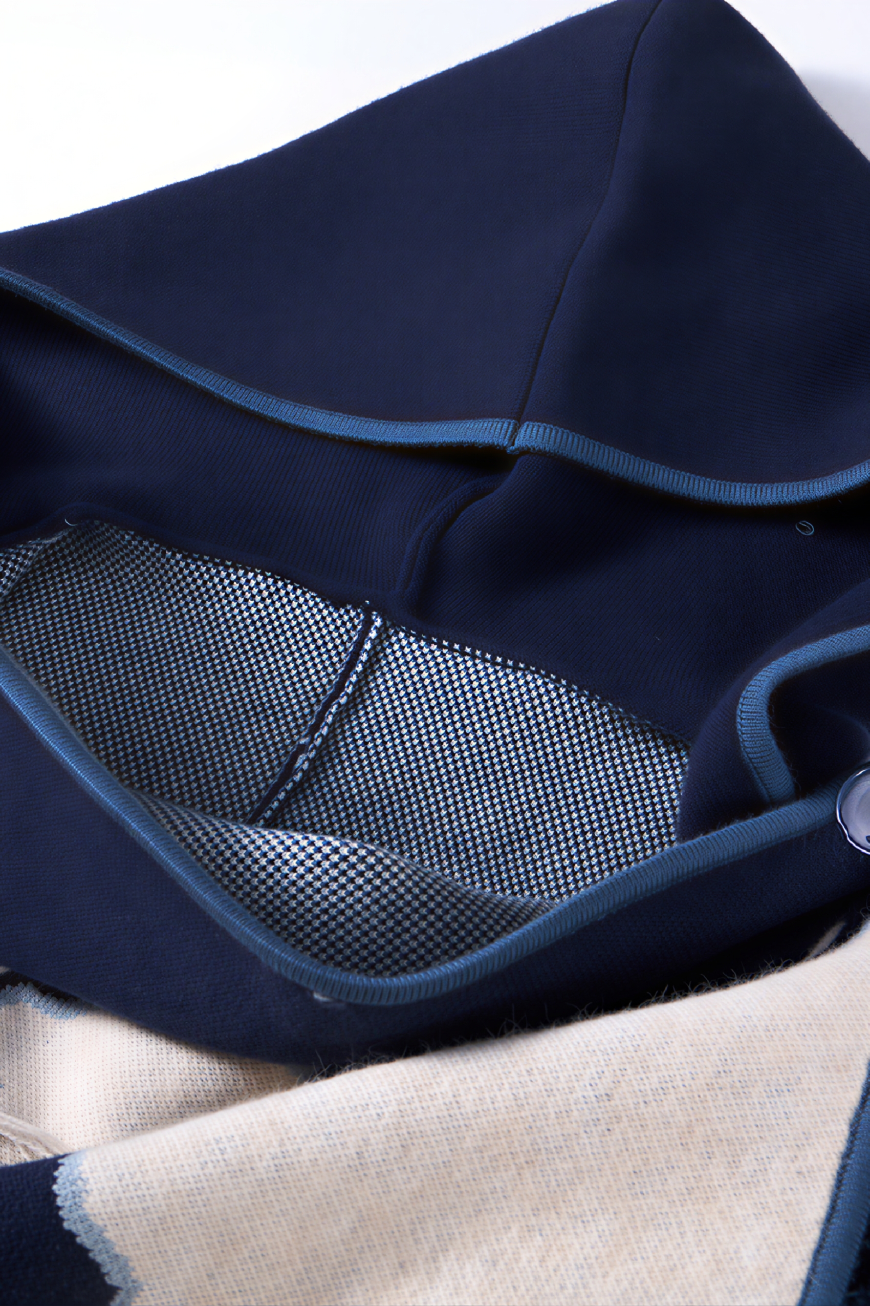 Hooded blue knitted cape