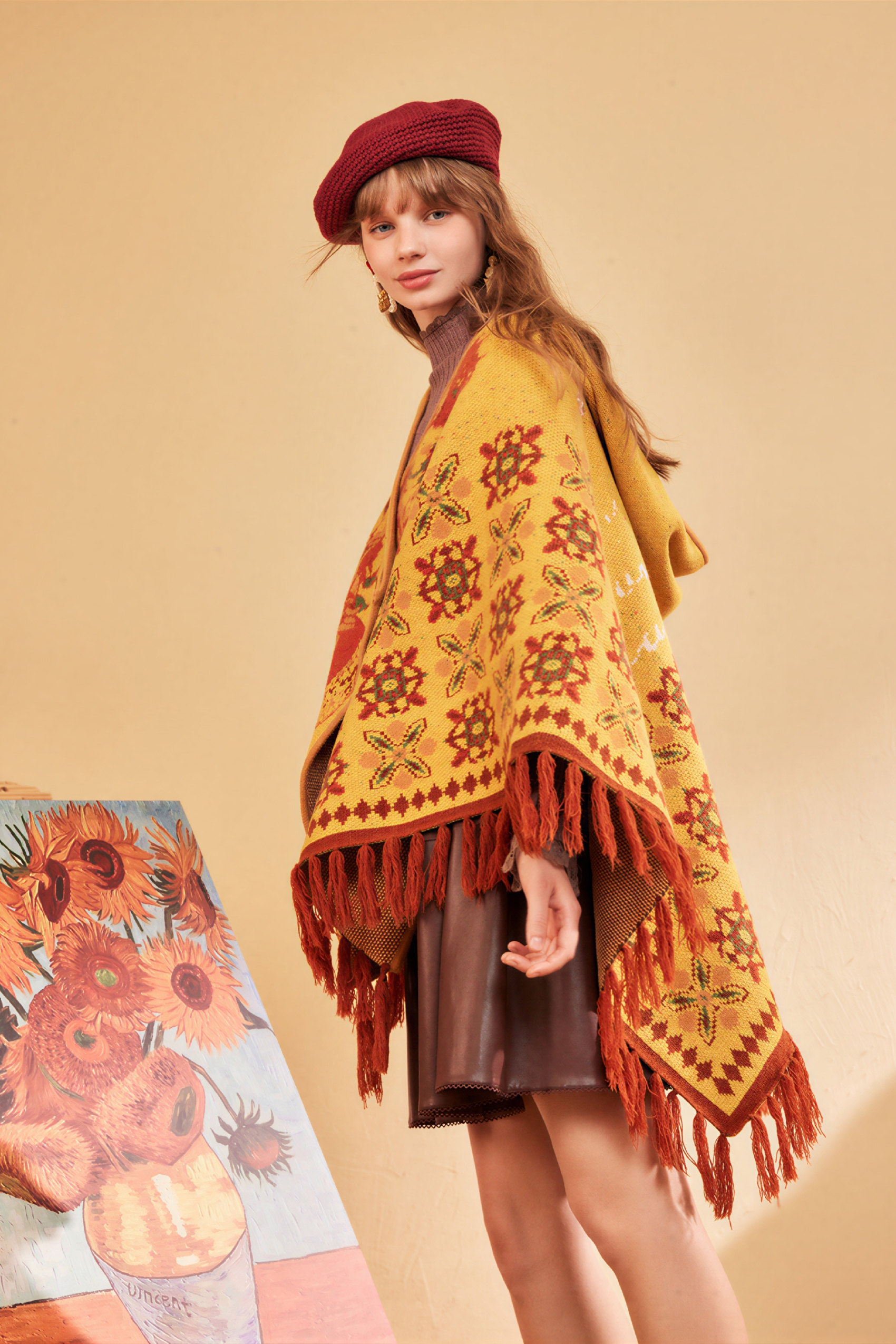 Hooded blue knitted cape