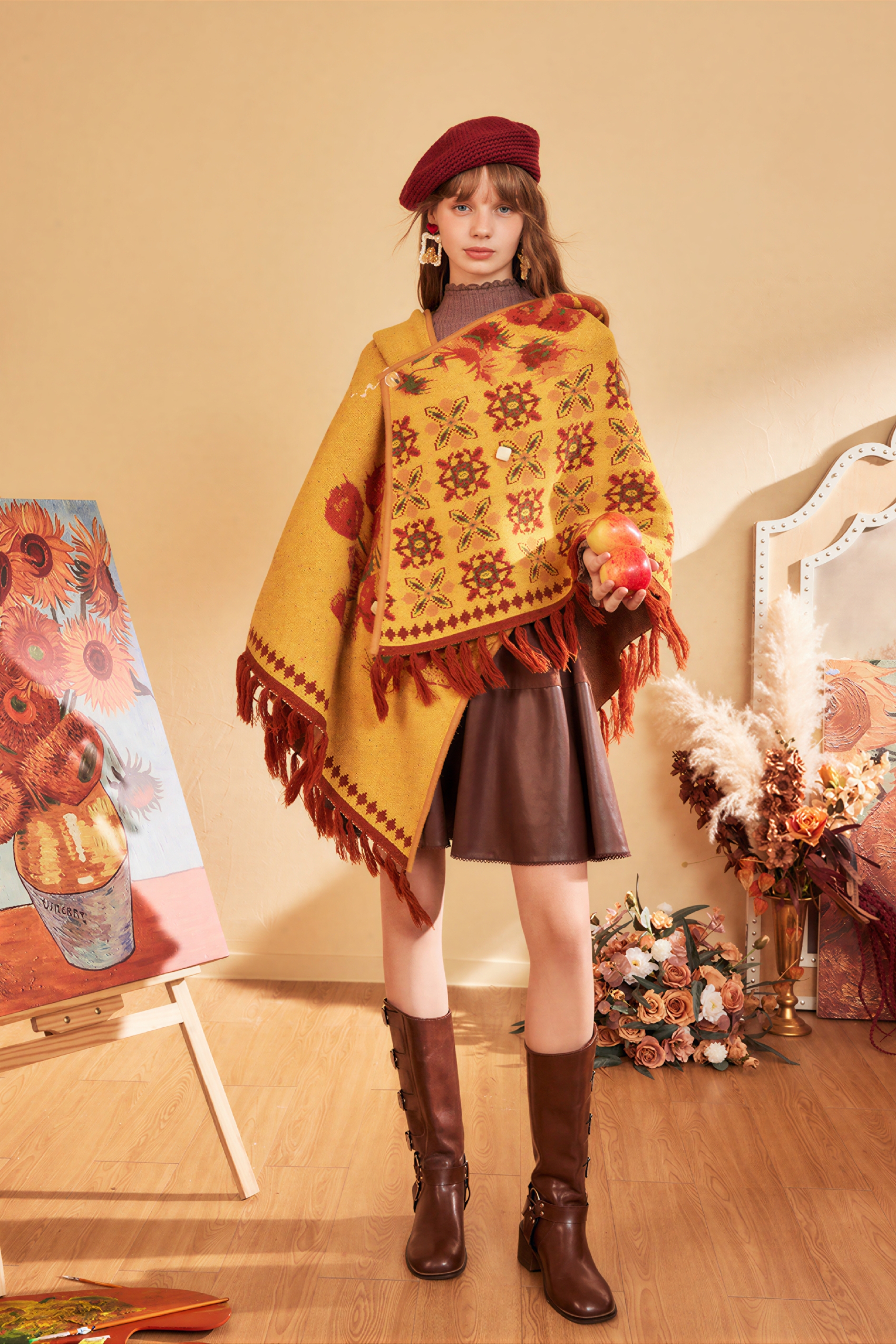 Hooded blue knitted cape