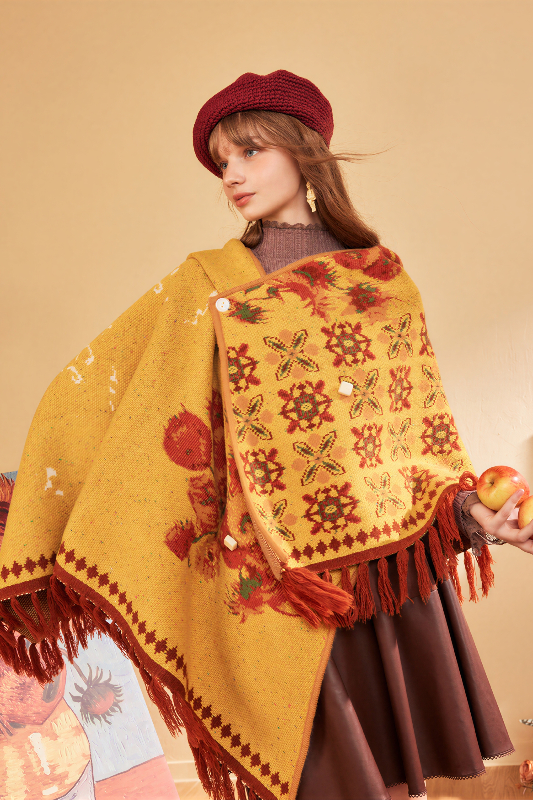 Hooded blue knitted cape