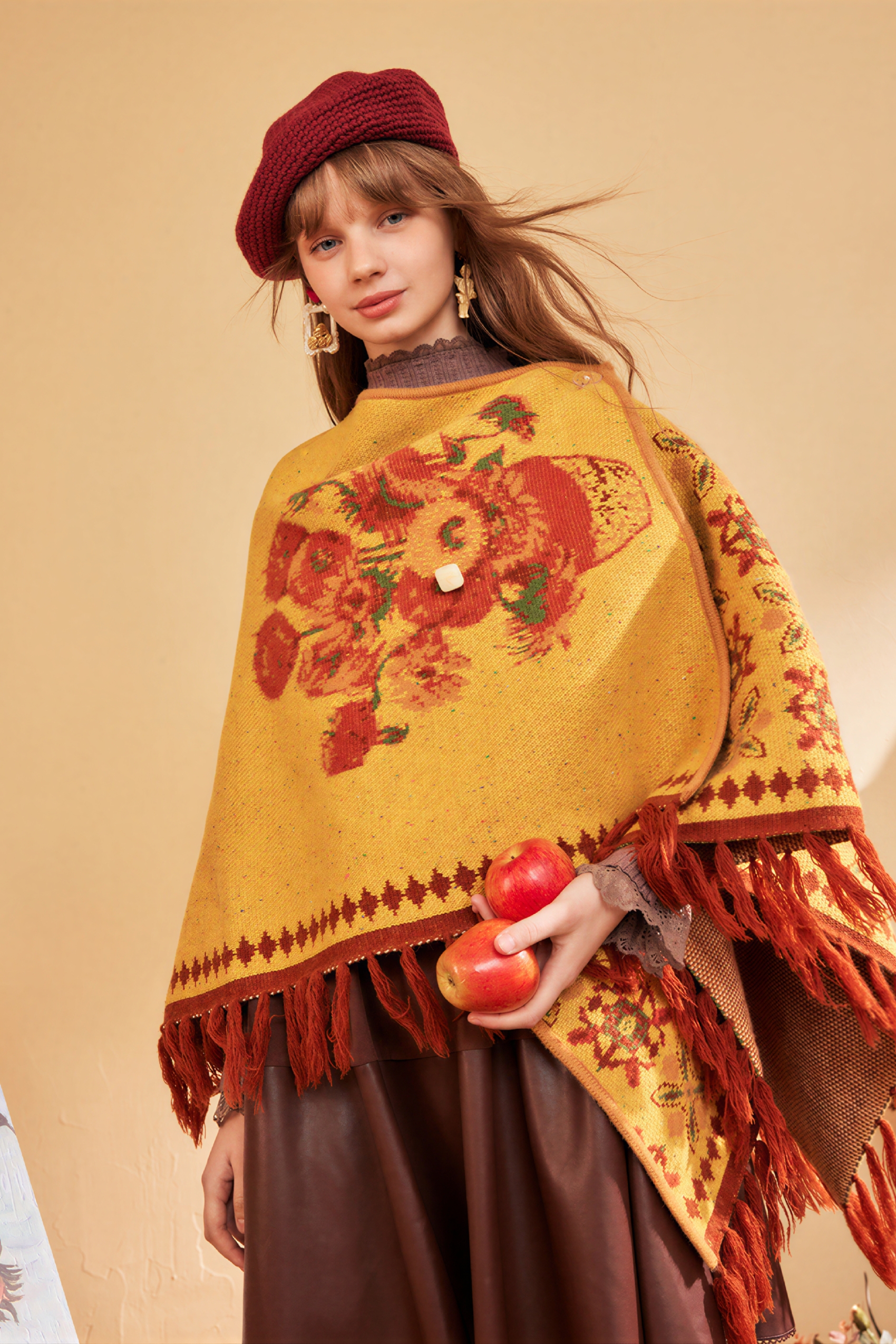 Hooded blue knitted cape