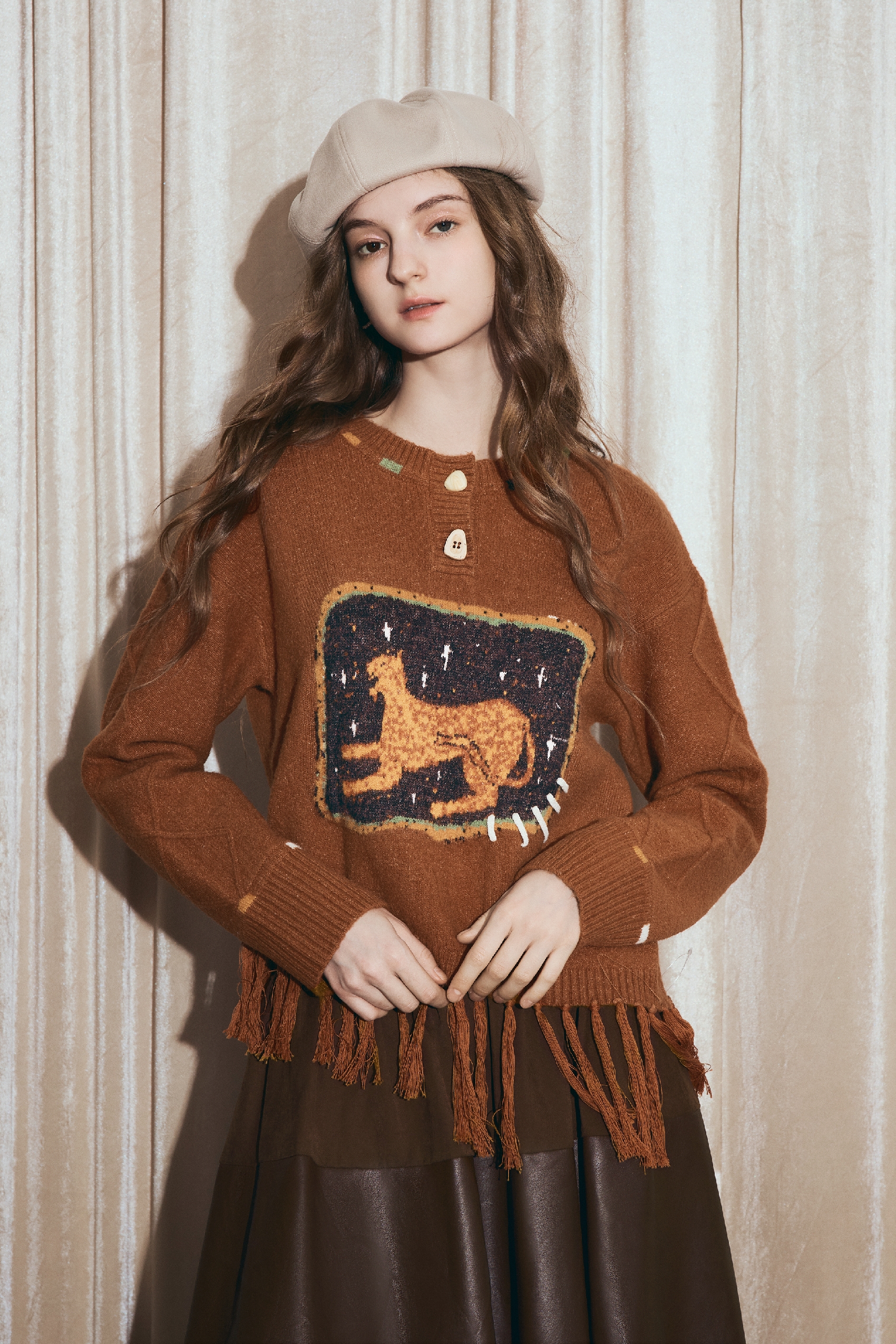 Round-neck jacquard sweater with tassels